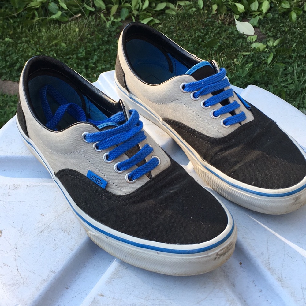 Black and gray lowtop vans